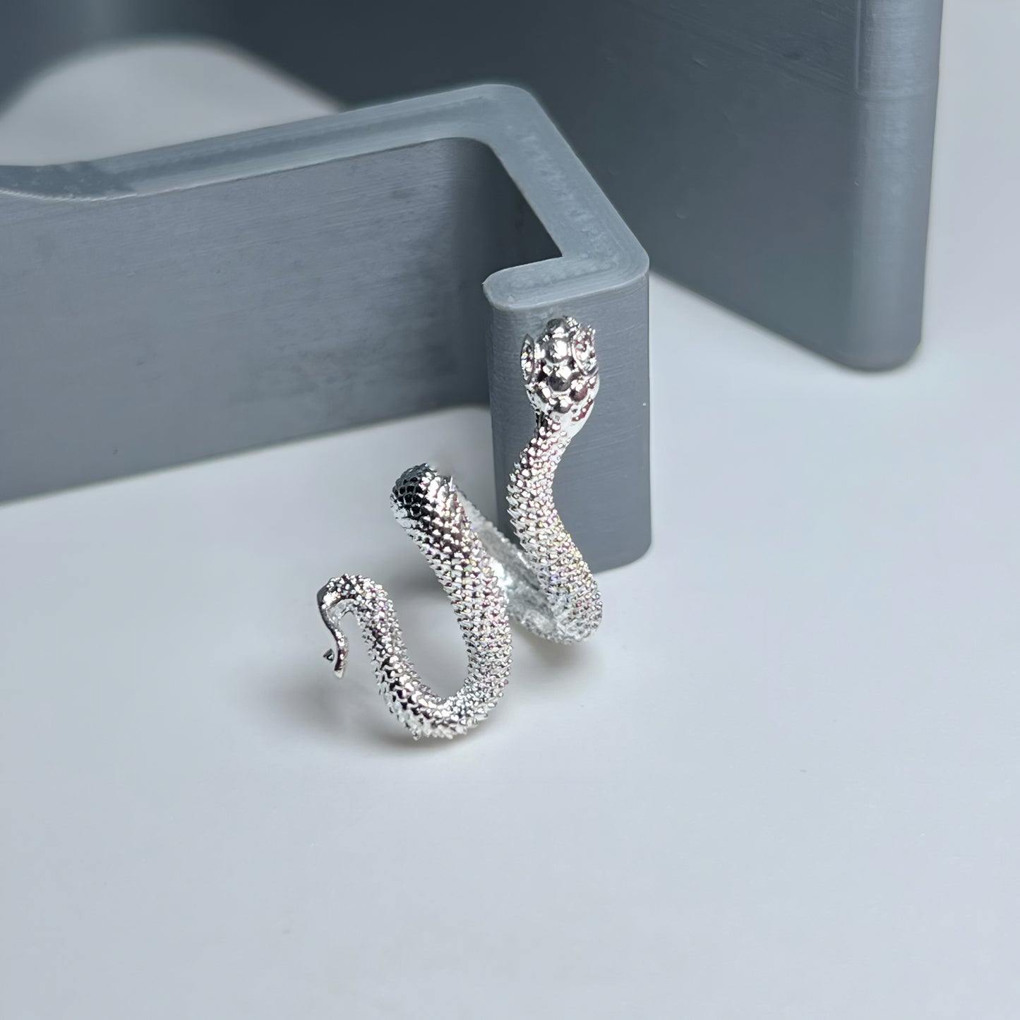 Snake Wrapped Metal Charm