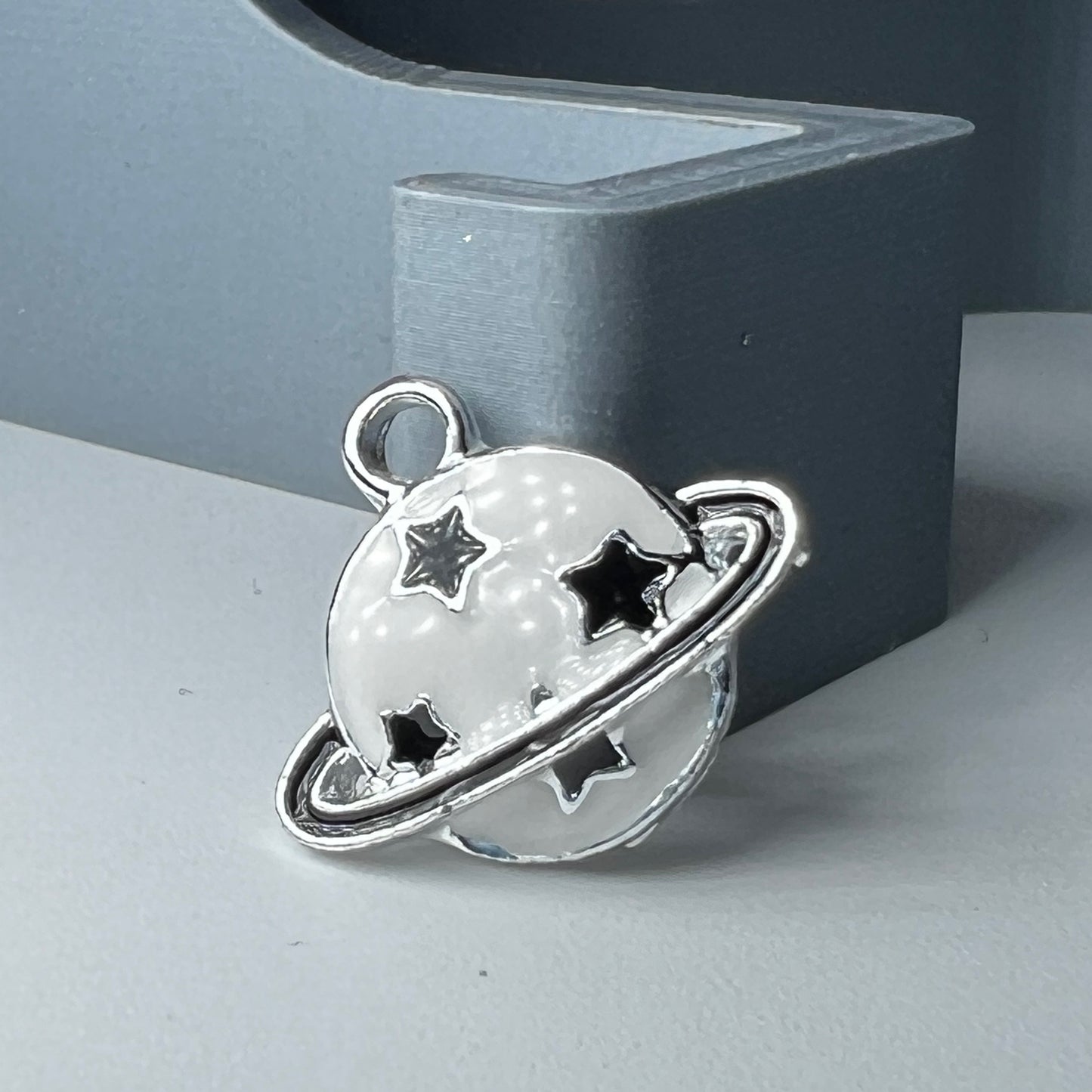 Silver; Black and White Saturn Charm