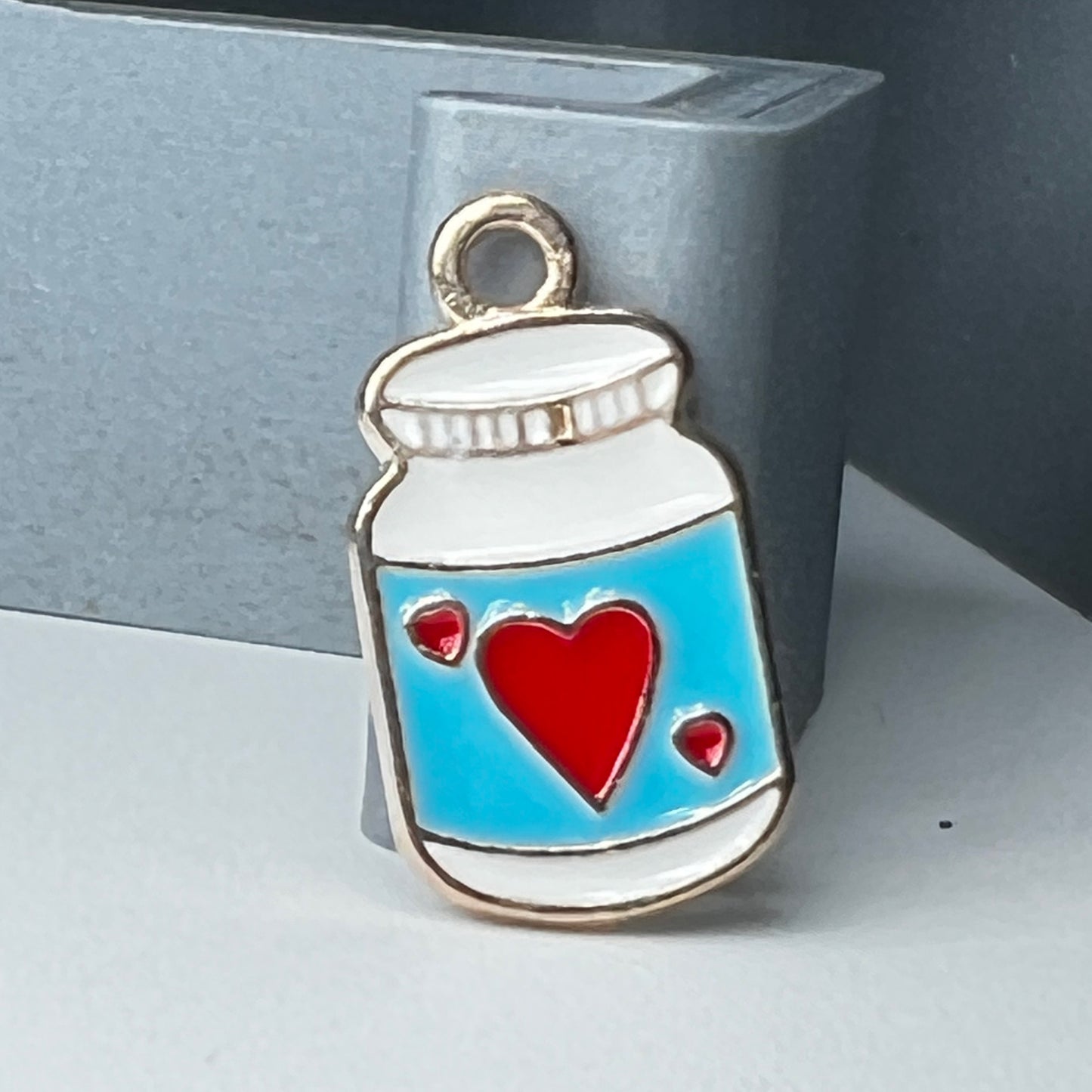 Gold Medicine Bottle Blue with Red Heart