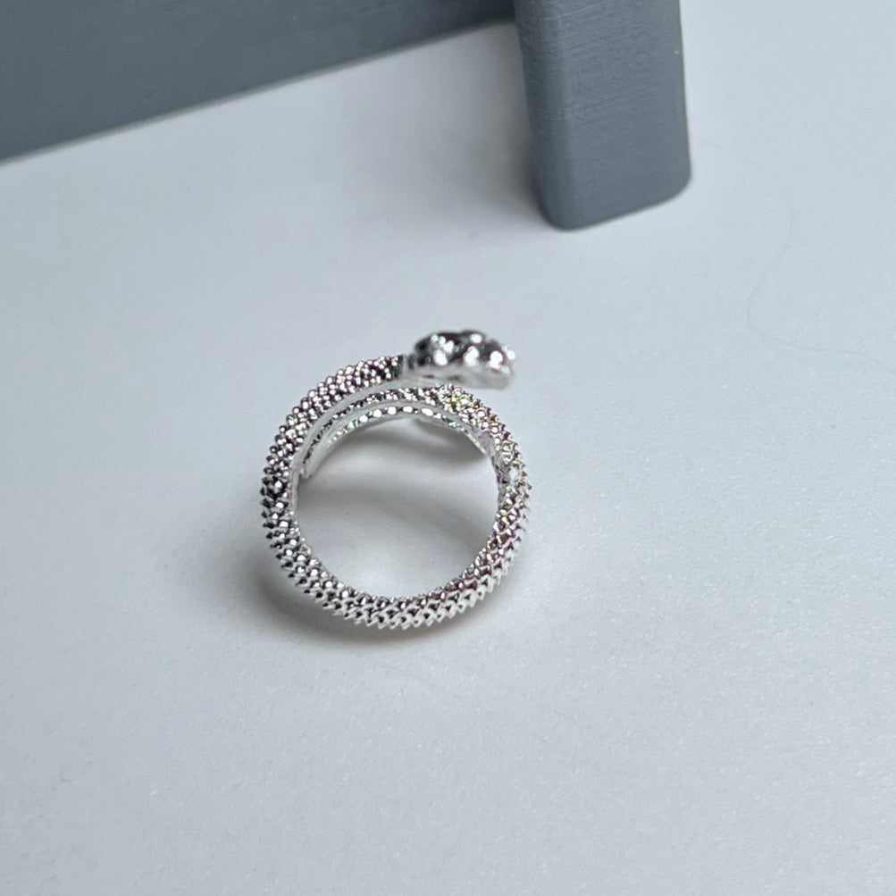 Snake Wrapped Metal Charm